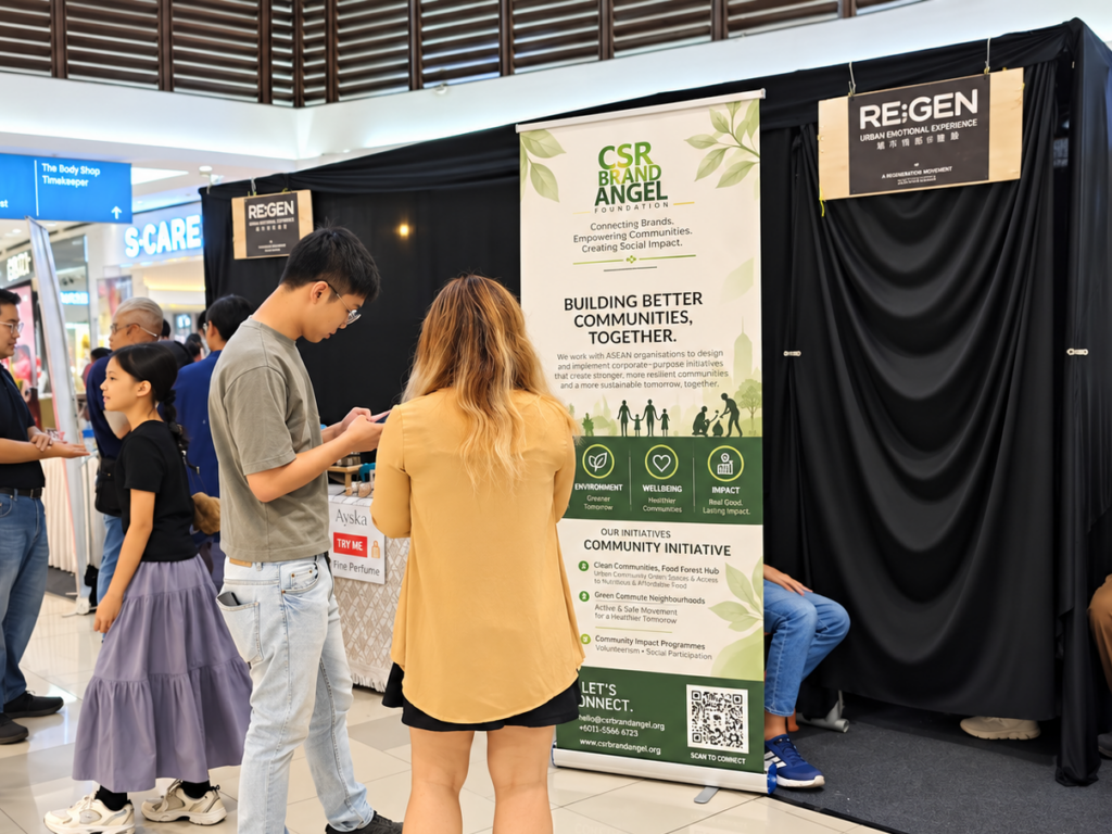 Visitors engaging with CSR Brand Angel Organisation and RE:GEN at a public event